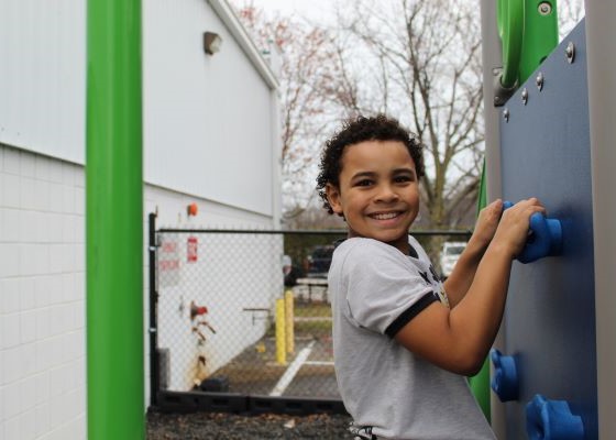 Student climbing on the playground