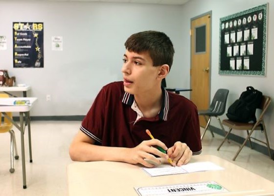 Student taking notes during a lesson