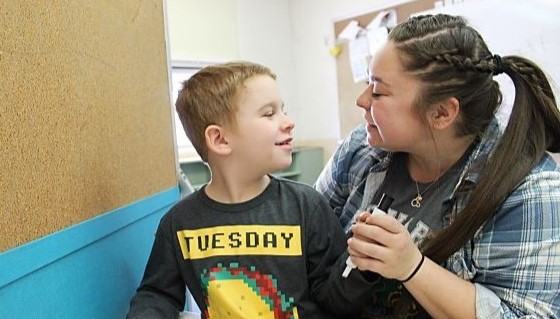 Student and teacher talking to each other